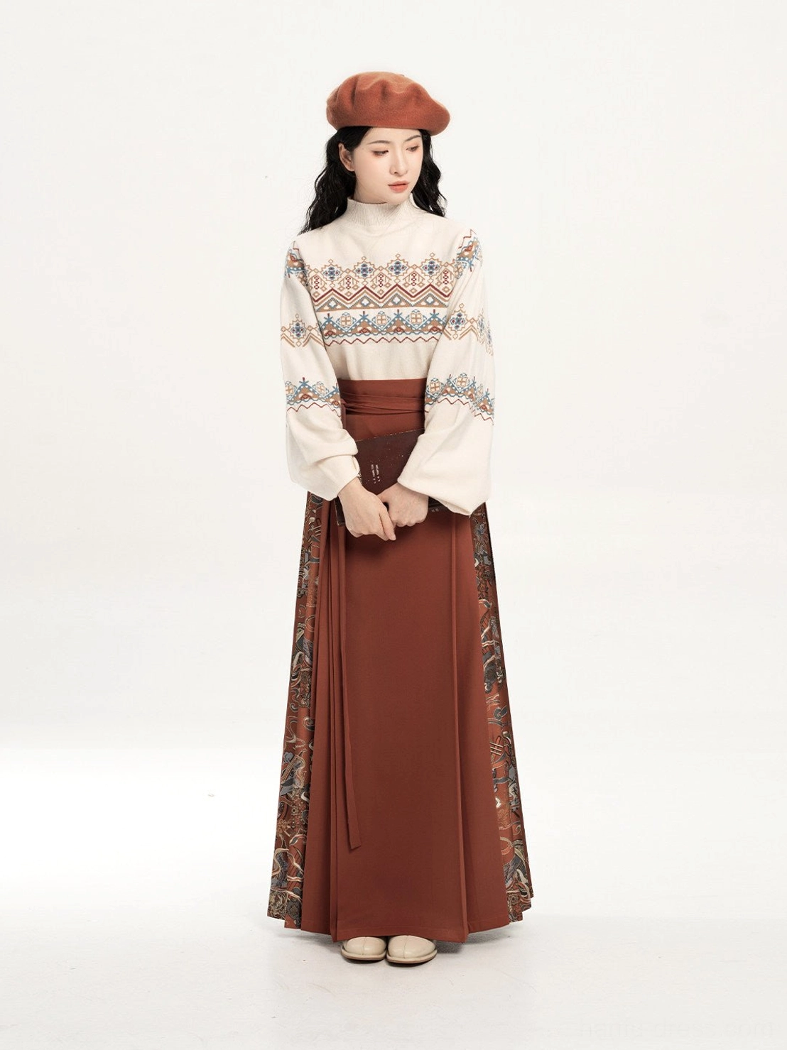 Full front view of a brick red Dunhuang-inspired turtleneck sweater and horse-face skirt hanfu outfit