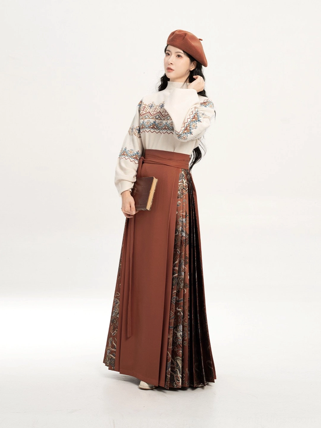 Side three-quarter view showing the printed pleated skirt panels and flowing drape of the brick red mamianqun hanfu set