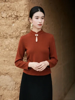 Brown Modern Hanfu stand collar knitted top with frog button detail worn with black midi skirt in front view