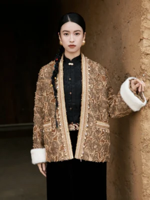 Front view of brown New Chinese style jacquard jacket with open front, decorative patch pockets, ethnic-inspired trim, and white cuffs