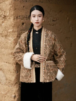Brown paisley jacquard modern Hanfu jacket worn by model in three-quarter front view, featuring decorative trim and white faux fur cuffs