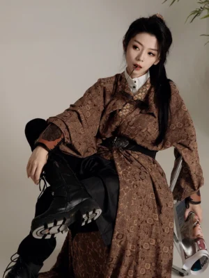 Brown Tang dynasty inspired jacquard Hanfu robe with wide belt and dramatic long sleeves styled with black boots