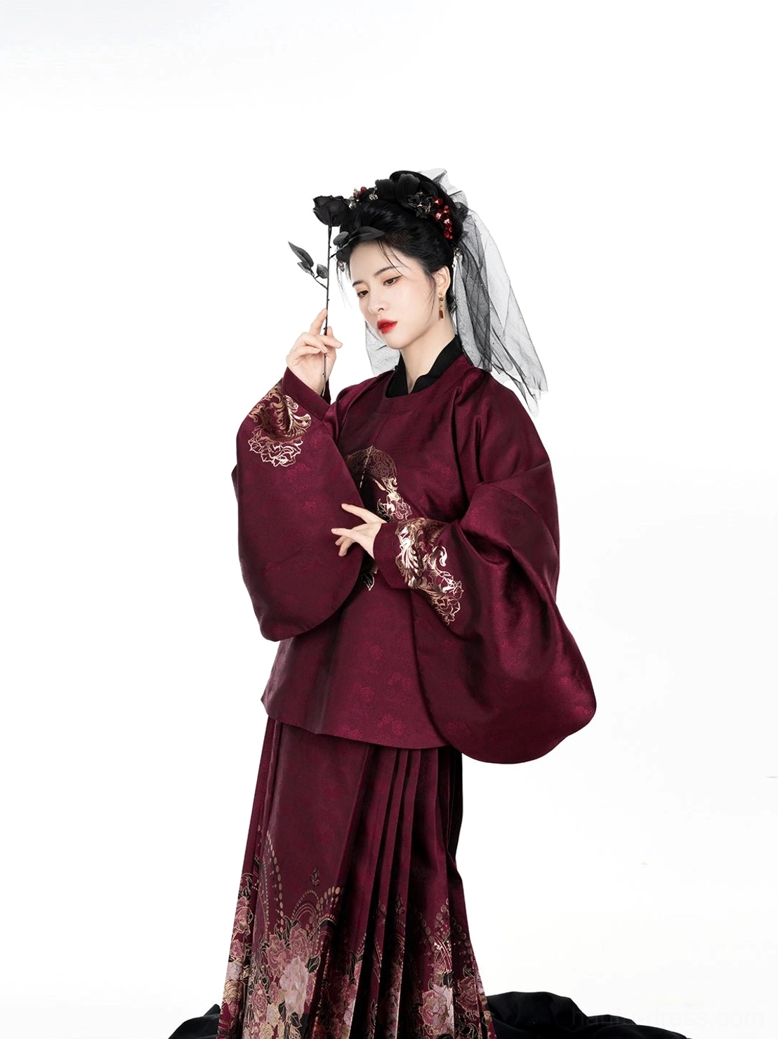 Close half-body view of the burgundy Ming Hanfu top highlighting rose embroidery on the chest and decorative sleeve cuffs