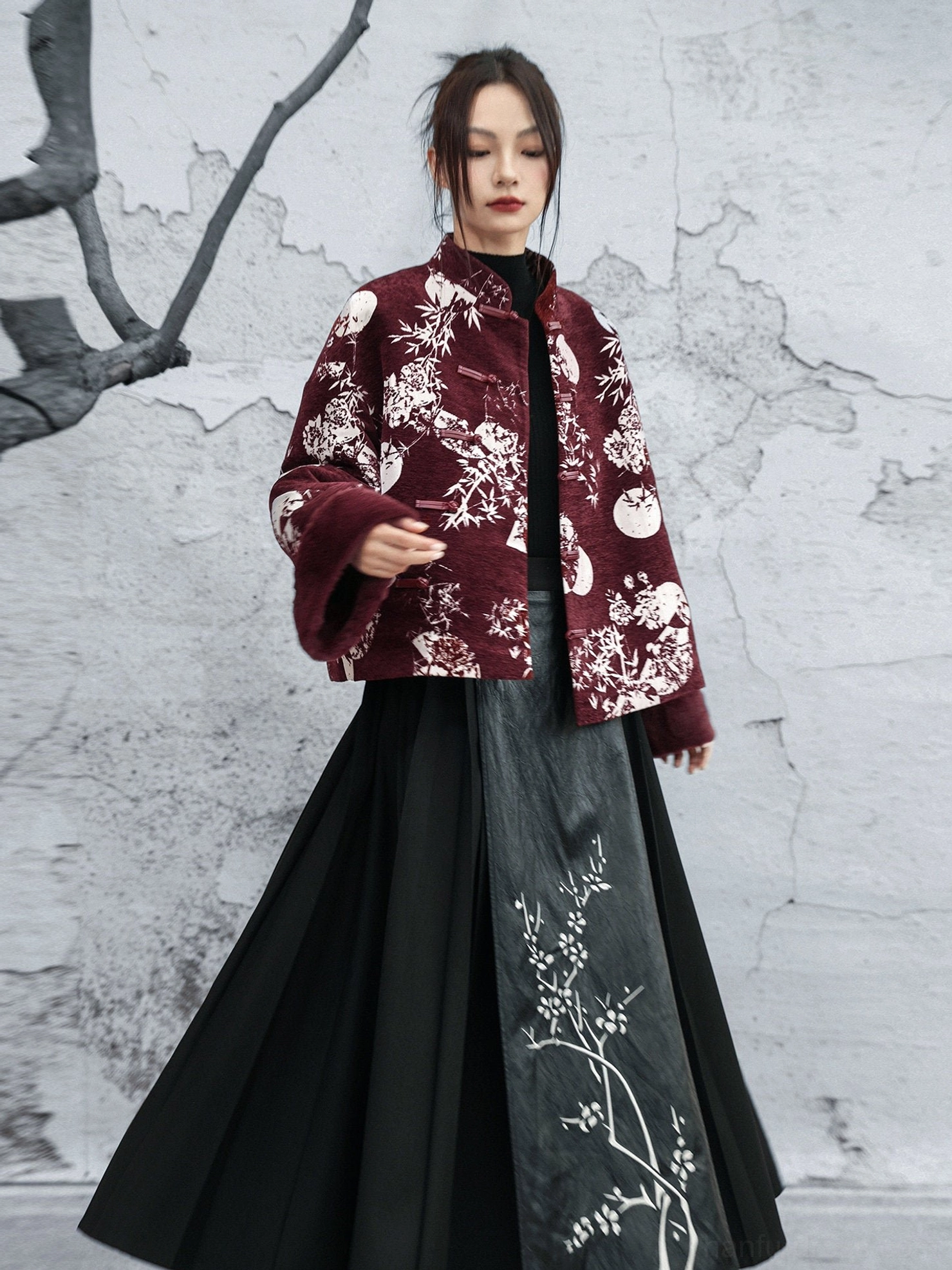 Burgundy modern Hanfu jacket styled with a black embroidered mamian skirt, white bamboo moon floral print, stand collar, and soft fuzzy cuffs