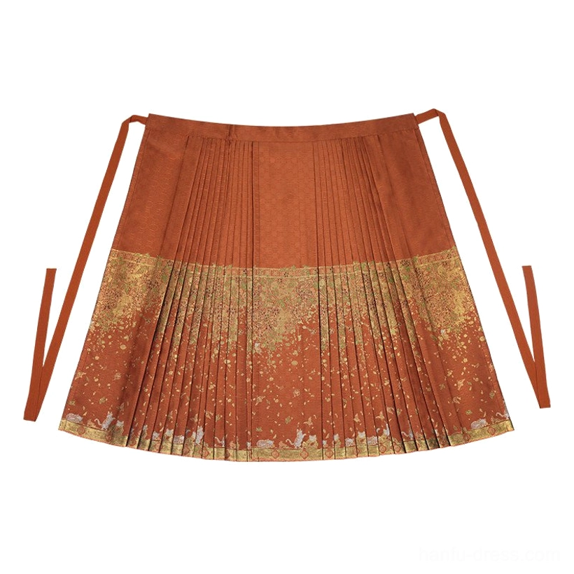 Flat lay of burnt orange gold brocade Ming Dynasty Mamianqun horse-face skirt with pleated silhouette