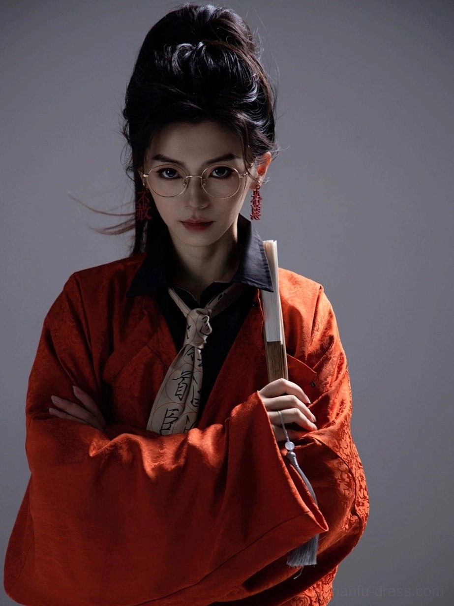 Bust close up of burnt orange Tang Dynasty Hanfu round collar robe with calligraphy scarf and folding fan wuxia styling