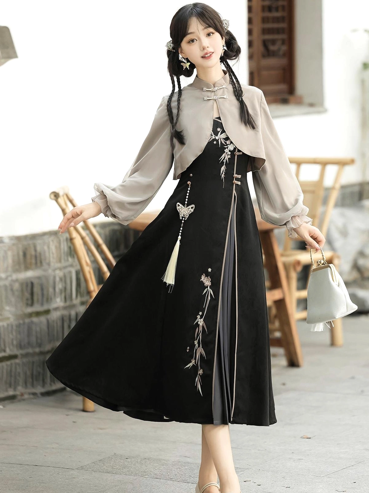 Rotating front view of the Butterfly Ash modern Hanfu summer sundress featuring a light grey chiffon-style cropped top, black embroidered dress, lantern sleeves, and matching tassel decoration