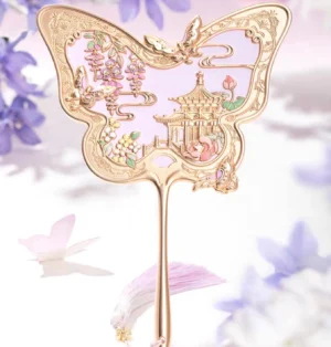 Front view of an elegant butterfly Chinese hand mirror with rose-gold frame, pastel enamel-style palace garden artwork, long handle, and floral decorations