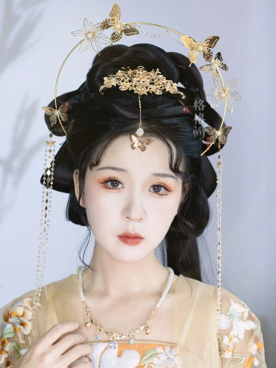 Butterfly Dance Hanfu hair accessory set worn with a floral traditional Chinese outfit, golden halo headpiece, matching necklace, and hanging tassels