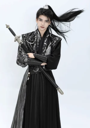 Canglan wuxia style hanfu for men in dynamic sword pose featuring silver dragon embroidery, black wrap skirt and waist belt