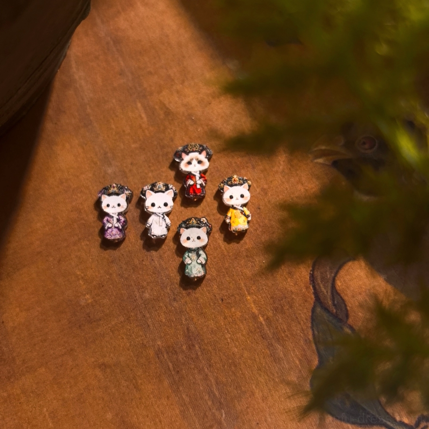 Cat empress Chinese earrings featuring colorful Qing court-inspired outfits and detailed miniature headpieces