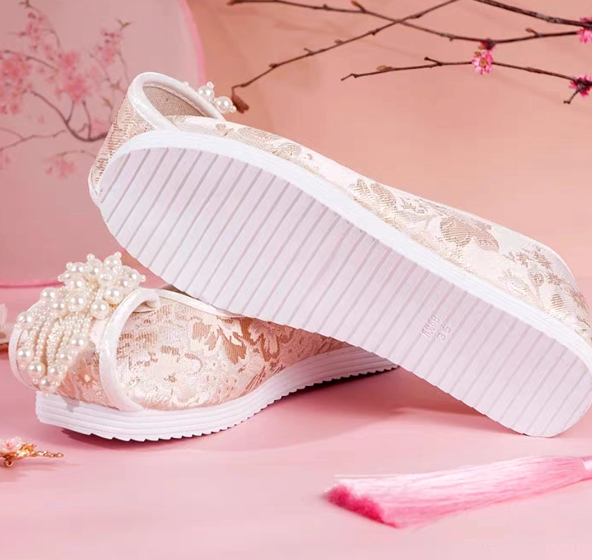 Traditional Chinese Hanfu shoes with champagne gold jacquard upper, pearl tassel decoration, classic round toe, and anti-slip striped white rubber outsole
