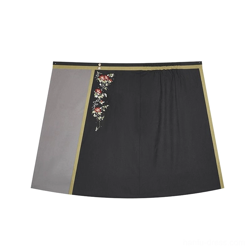 Flat lay of charcoal grey Song style wrap spiral skirt with olive trim floral waist embroidery and elastic waistband