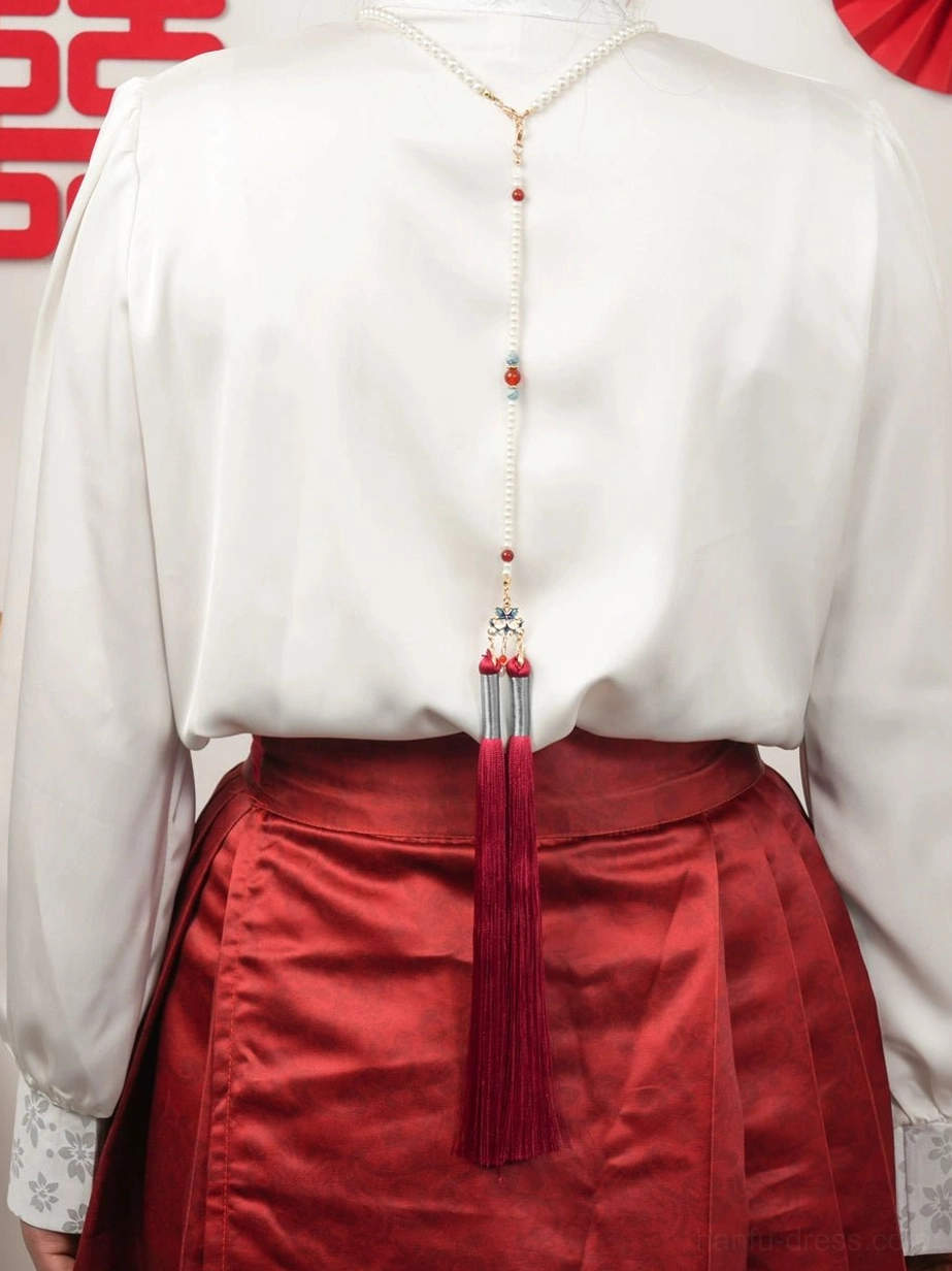 Back view of Chinese bridal Hanfu necklace on model showing the long red tassel and beaded chain draping down the back
