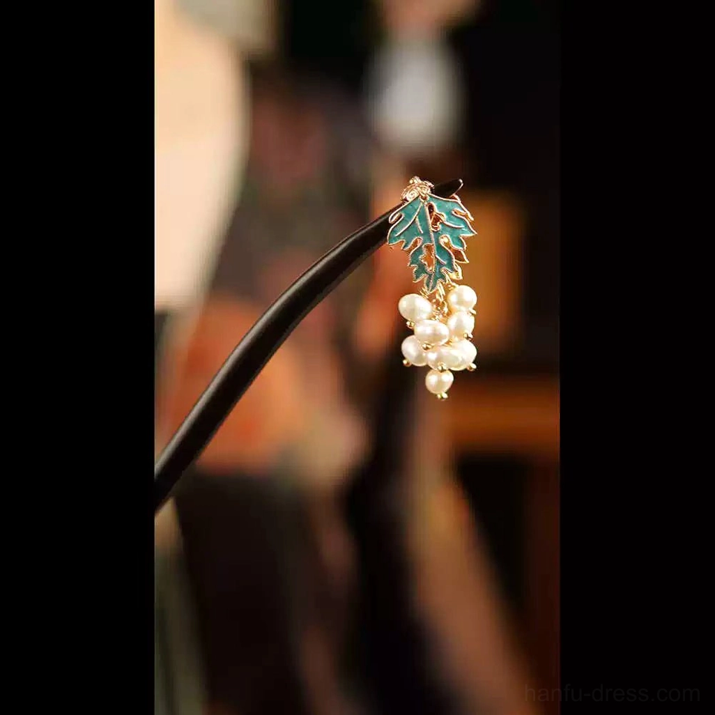 Right-side close-up view of Chinese hair stick featuring grape-inspired imitation pearls, cyan enamel leaf, and gold-tone ornament