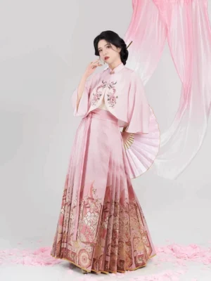 Three-quarter view of a Chinese hanfu blouse and mamian skirt outfit with floral embroidery, vintage printed hem, and folding fan styling