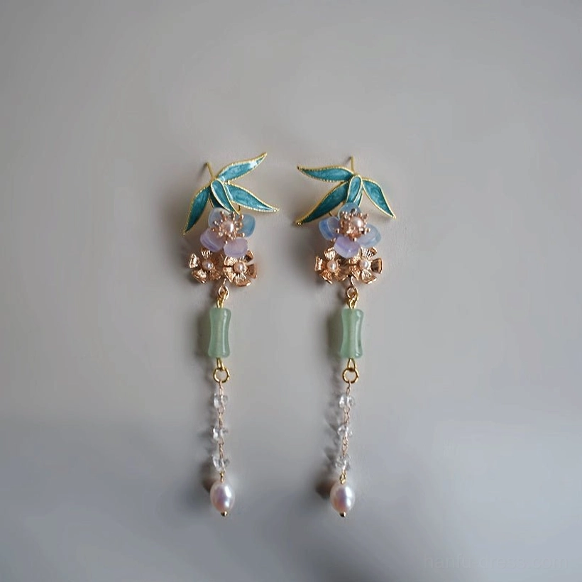 Pair of Chinese-style Hanfu drop earrings with enamel bamboo leaf accents, jade-like green pendants, pearl-style tassels, and gold-toned hardware