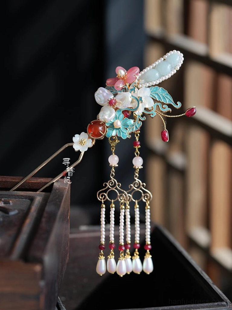 Detailed Chinese hairpin ornament with imitation jade accents pink flowers blue cloisonne-style elements red agate-style beads and double-strand pearl tassels