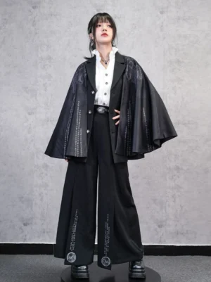Full body view of Chinese inspired modern Hanfu printed cloak styled with a ruffled white shirt, wide-leg trousers, and metallic belt