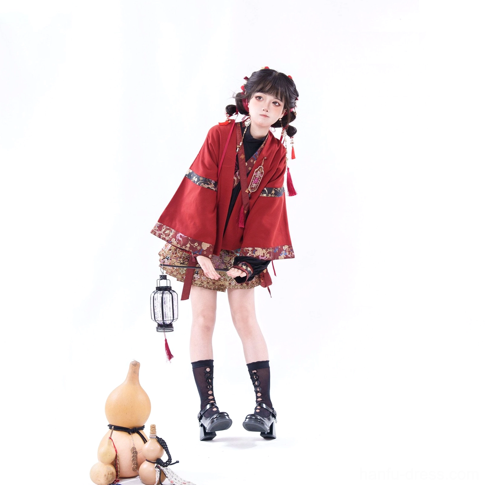 Festive Chinese New Year Hanfu dress with embroidered short Mamian-inspired skirt, red tassel hairpins, and black lace-up boots