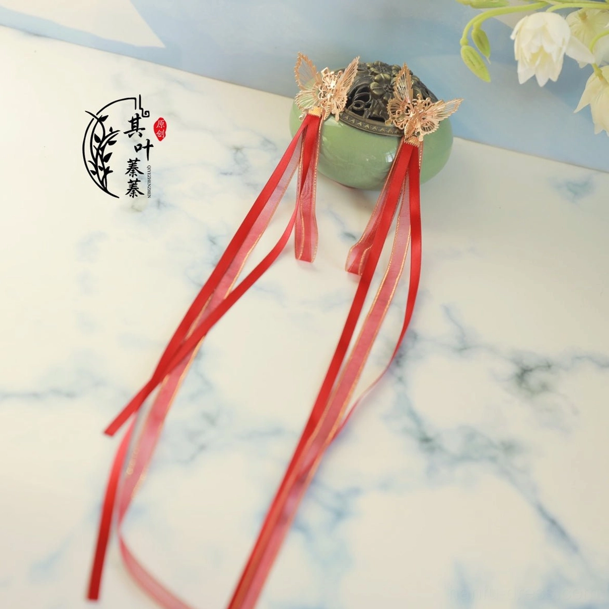 Gold butterfly Hanfu hair clips with long flowing red ribbon tassels for Chinese New Year and traditional hairstyle styling