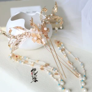 Traditional Chinese phoenix flower tassel hairpin with champagne gold openwork metal, faux pearls, light blue beads, and elegant Hanfu hair accessory styling