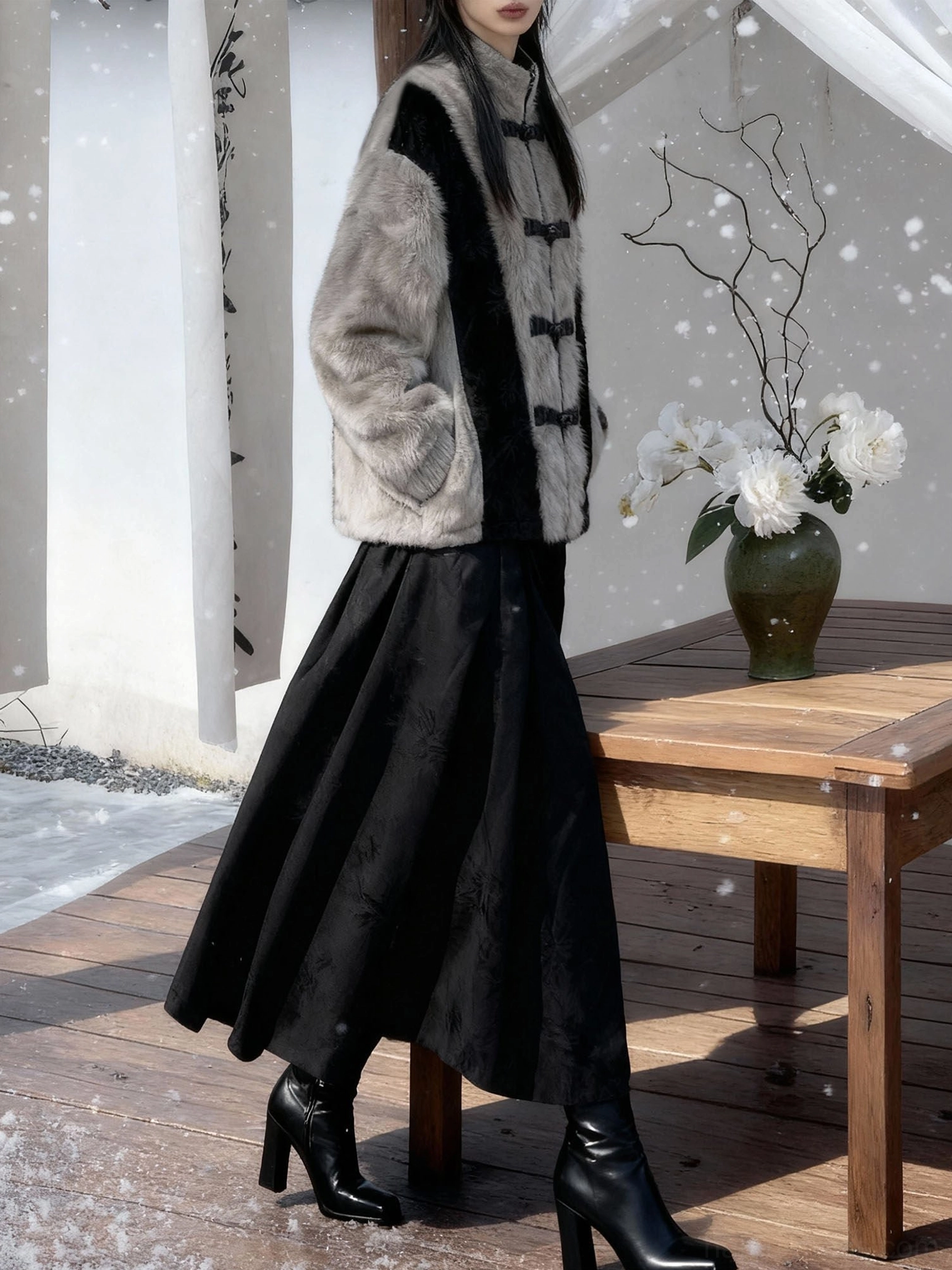 Side view of a relaxed Chinese-inspired faux rabbit fur jacket with side pockets, black contrast panels, and a mid-length modern hanfu coat silhouette