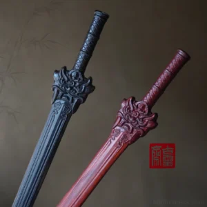 Traditional Chinese sword-shaped hair sticks in black and wine red with carved mythical beast head ornaments, textured grips, and engraved blade details for Hanfu hairstyles