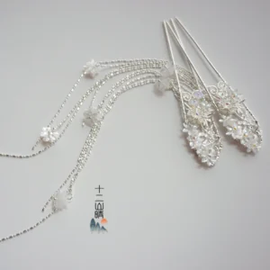 Chinese traditional floral tassel hair pin showing silver-toned metal crystal flower ornaments beaded chains and elegant hanging pendants