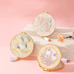 Chinese vintage folding pocket mirrors with round gold-tone frames, pastel floral bird artwork, decorative tassels, and elegant traditional Chinese styling
