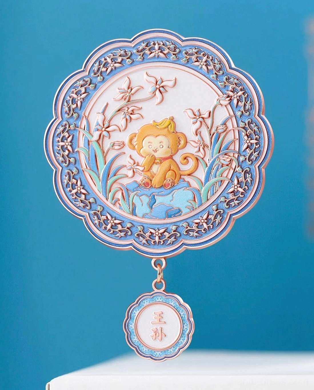 Chinese zodiac monkey blessings pocket mirror with colorful floral artwork and suspended medallion-style zodiac charm