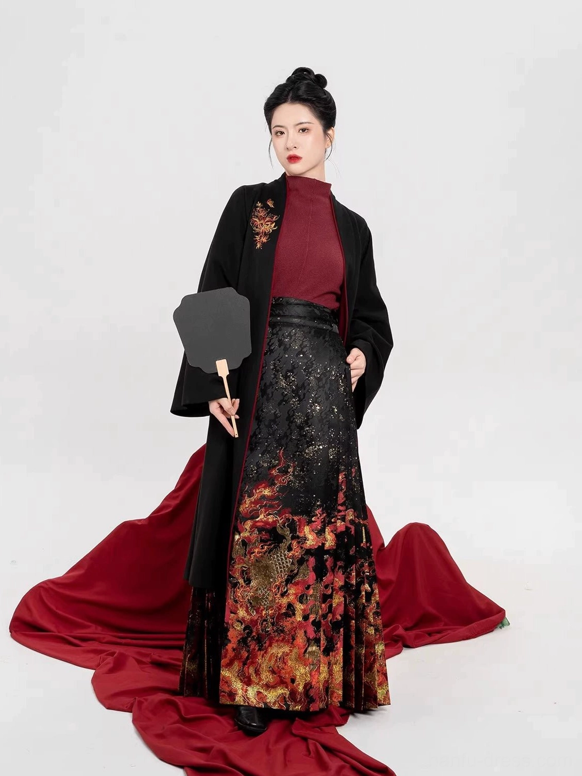 Three-quarter view of Chiyan Ming Dynasty Hanfu full set with black wide sleeve coat burgundy top and mamian skirt