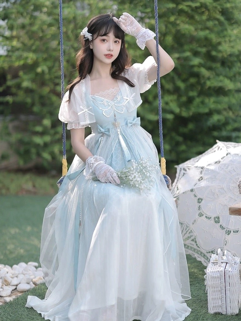 Front full-body view of Cinderella blue gradient Tang-inspired Hanfu dress set with sheer puff sleeve coat in an outdoor garden