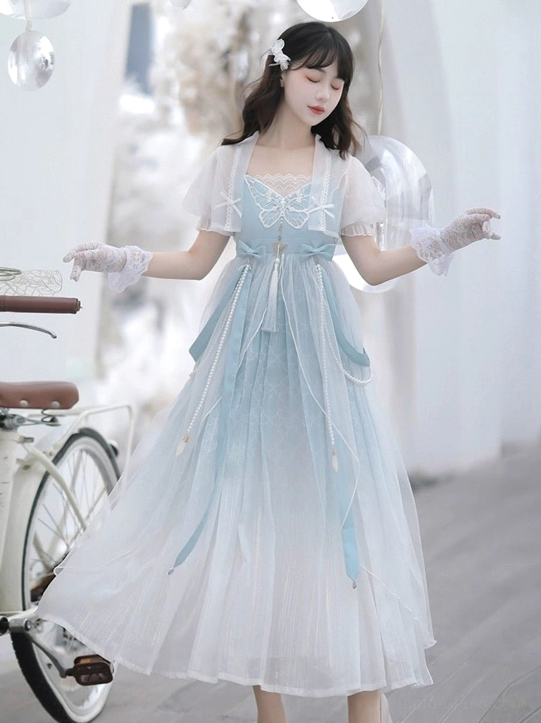 Three-quarter view of blue gradient Tang-inspired Hanfu dress featuring sheer puff sleeves and long layered tulle skirt
