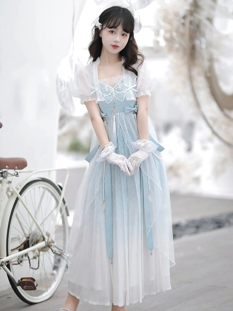 Front view of modern blue and white Tang style Hanfu dress with square neckline, waist ribbons, and flowing tulle skirt
