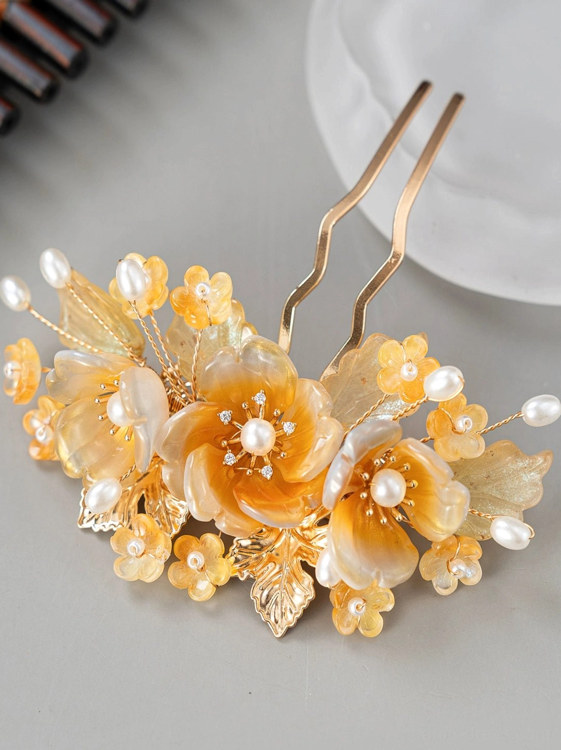 Classical Chinese Hanfu hair comb crown with amber flower cluster, faux pearls, gold-tone leaves, and elegant decorative details for traditional hairstyles