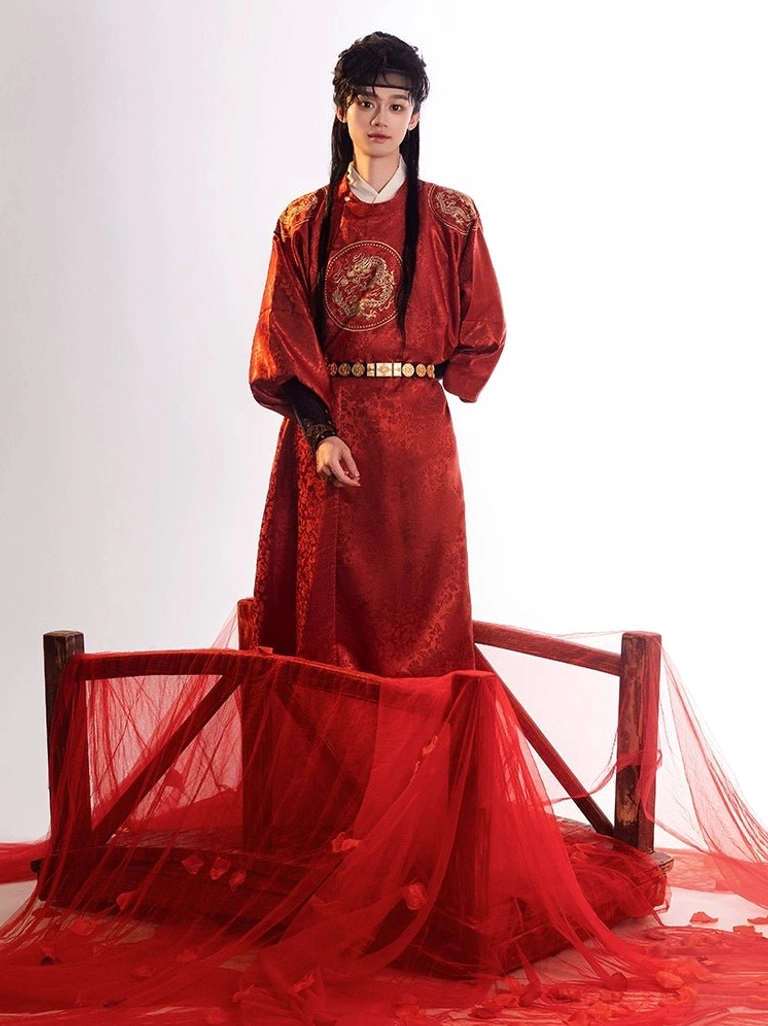 Three-quarter standing view of crimson men’s Tang Dynasty hanfu robe featuring textured fabric and golden dragon chest embroidery