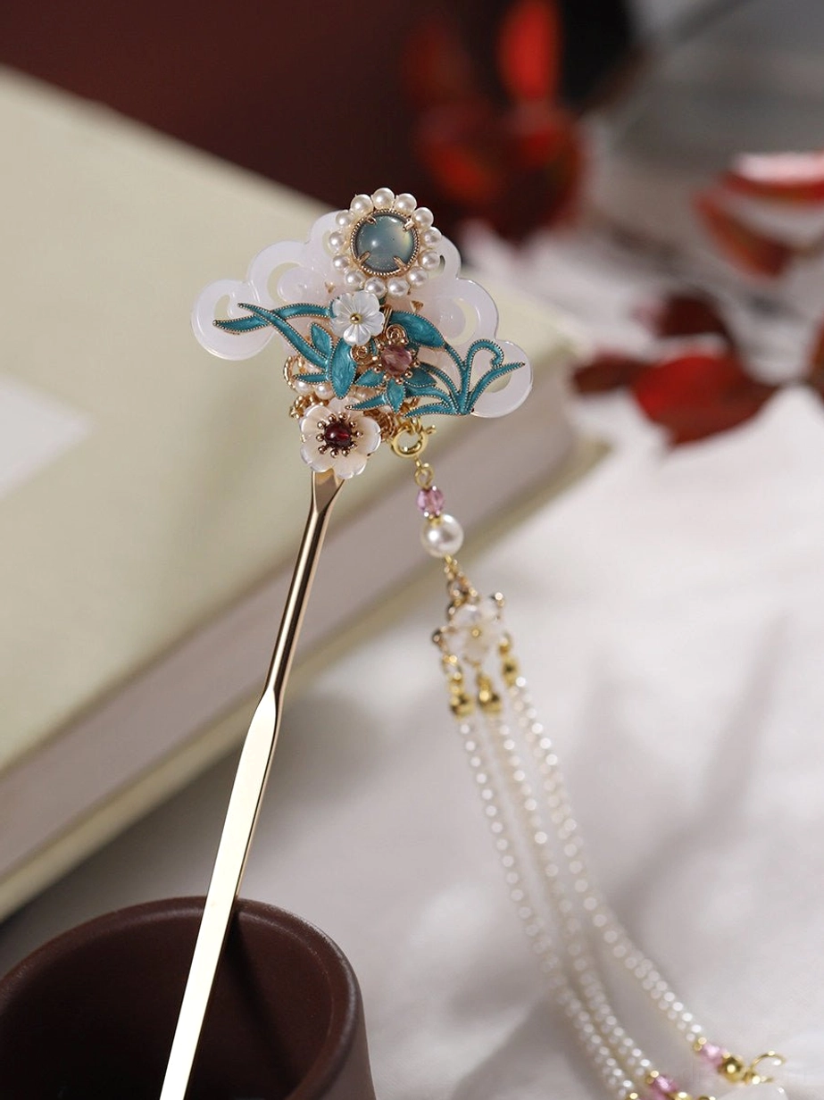 Traditional Chinese hair stick with antique-inspired blue cloisonne orchid design, round center accent and pearl-style tassel for Hanfu hairstyles