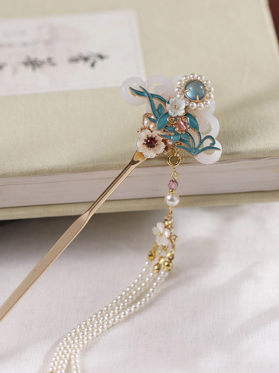 Gold-tone Hanfu hair stick shown from the side with compact blue floral cloisonne-style top ornament and delicate pearl-style hanging tassel