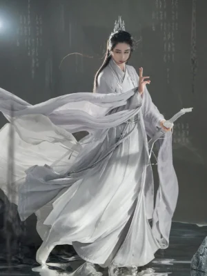 Three-quarter front view of light grey gender-neutral Cloud Lord Hanfu with oversized sleeves, layered cross-collar robes, flowing hem, silver fantasy styling, and waist ornaments