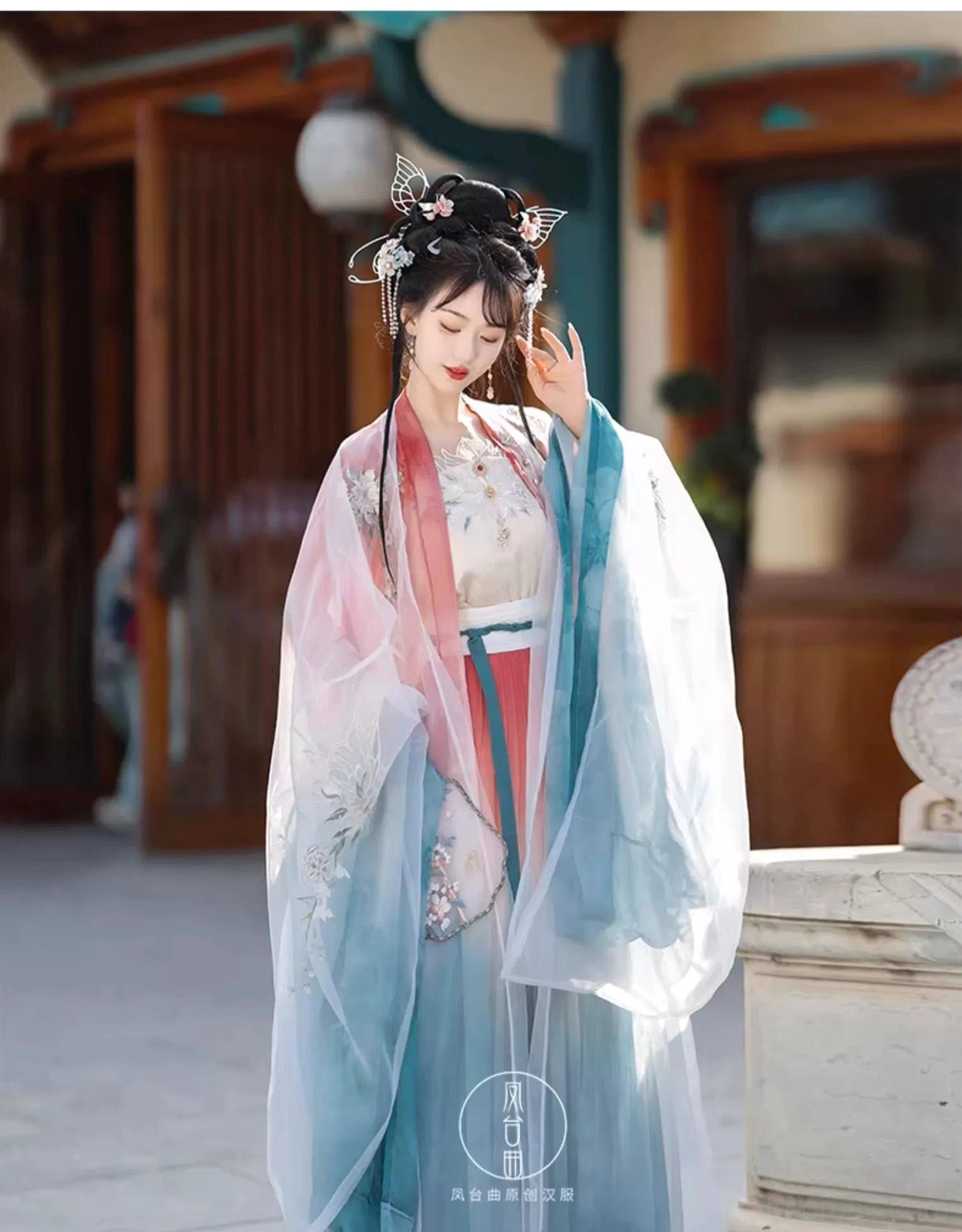 Three-quarter view of colorful Wei Jin inspired Qiyao Ruqun Hanfu with pink red cyan layers embroidered cape and detailed sleeves