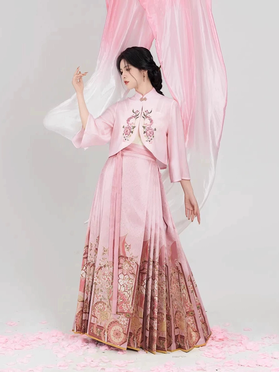 Side view of a complete dusty pink hanfu outfit showing floral chest embroidery, pleated skirt construction, and coordinated traditional styling