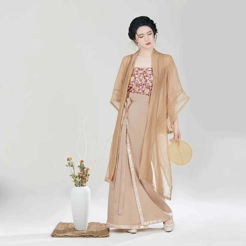 Angled front view of the complete Fog Flower Song Dynasty modern Hanfu set with floral camisole, sheer beizi jacket, wrap skirt, traditional hairstyle, and wooden fan