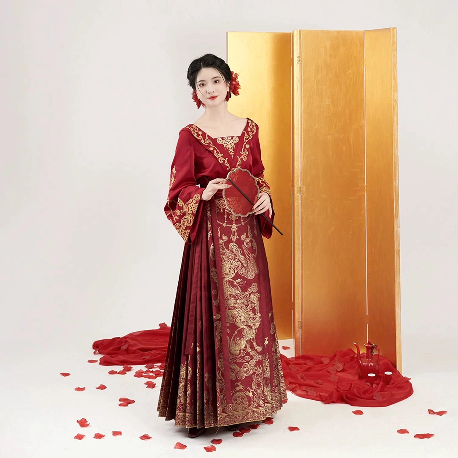 Complete Ming Dynasty wedding Hanfu set with crimson shoulder-baring top and gold brocade Mamian skirt front view