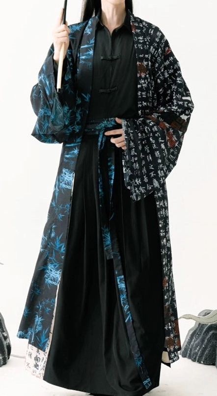 Front view of a complete Ming inspired Hanfu outfit for men with dual pattern outer robe, ancient calligraphy print, blue bamboo motifs, and black layered garments