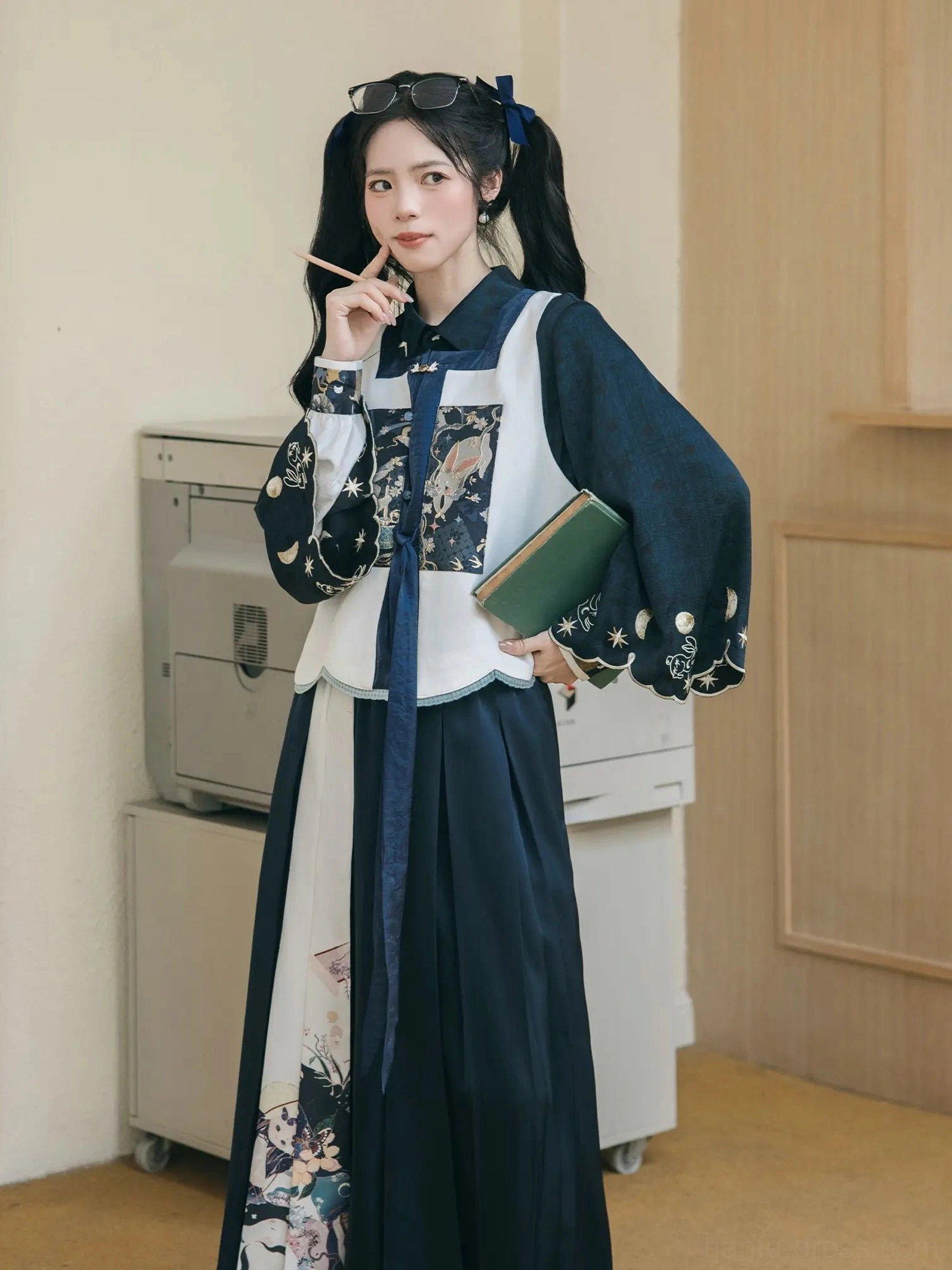 Front view of a model wearing the complete Ming inspired modern Hanfu set with matching bijia vest, neck sash, long skirt styling, and laurel side details