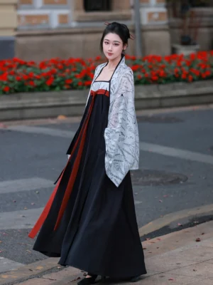 Front side view of a complete modern Hanfu outfit with flowing black dress, red waist sash, and wide-sleeved printed jacket