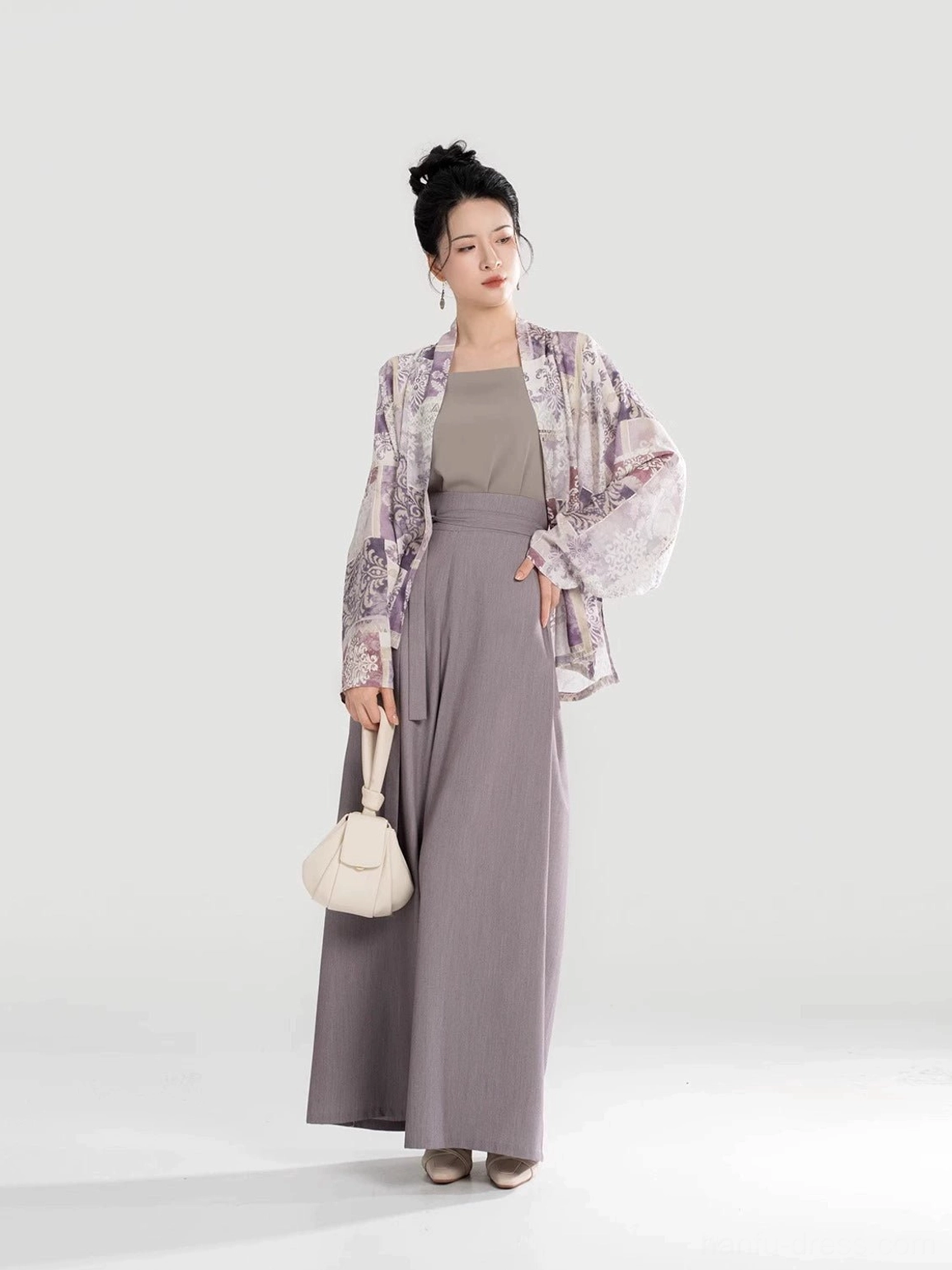 Complete modern Hanfu suit in a three-quarter view featuring a purple winged-sleeve top taupe camisole high-waisted pants and waist sash