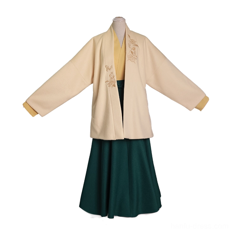 Three-quarter mannequin display of the complete modern Song Dynasty Hanfu set with floral embroidered jacket, coordinated inner top, and green wrap skirt