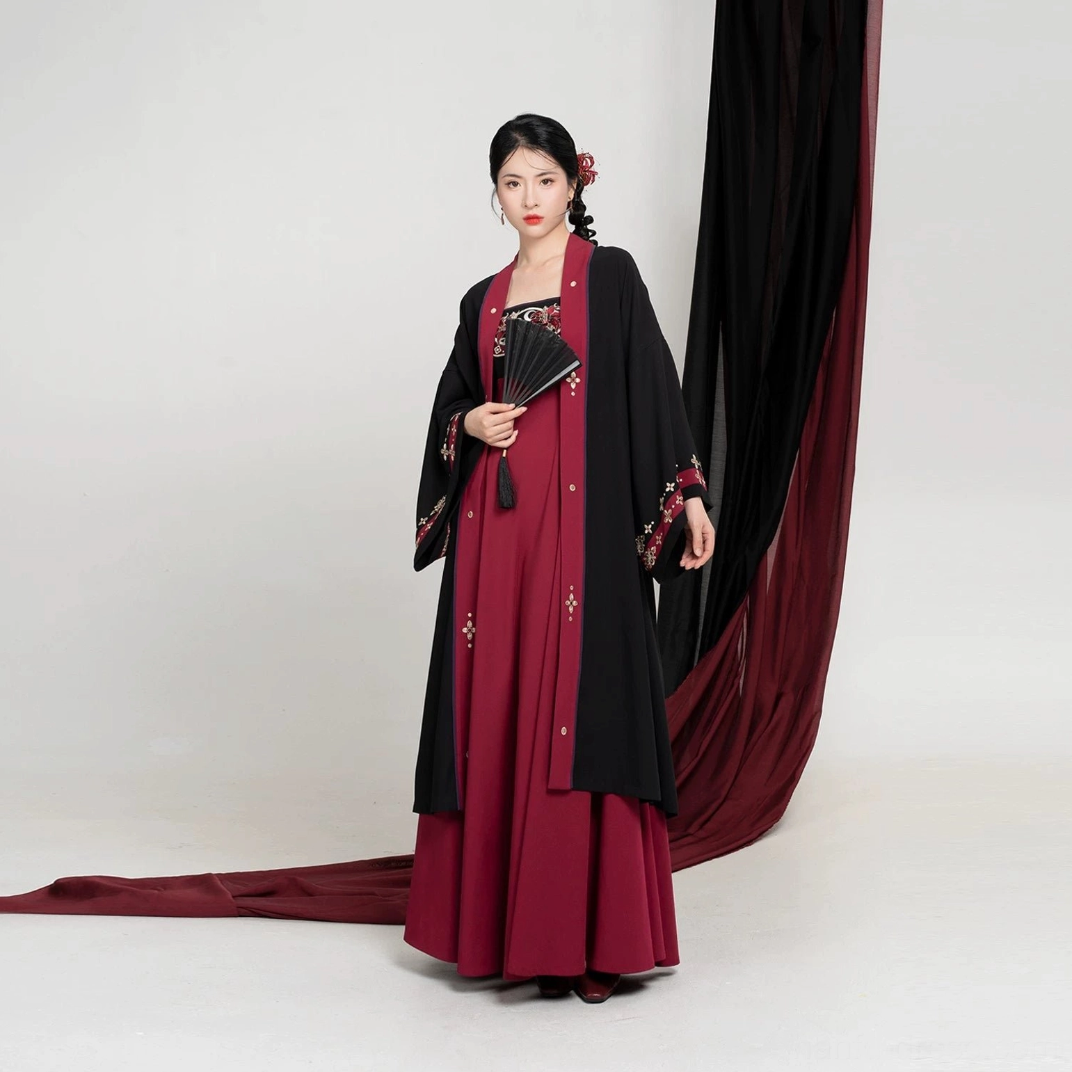Complete modern Tang Dynasty Hanfu set with black open-front Beizi jacket, crimson scarlet embroidered slip dress, red piping, and traditional hairstyle